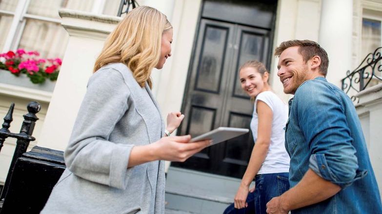 Landlord showing property to prospective tenants
